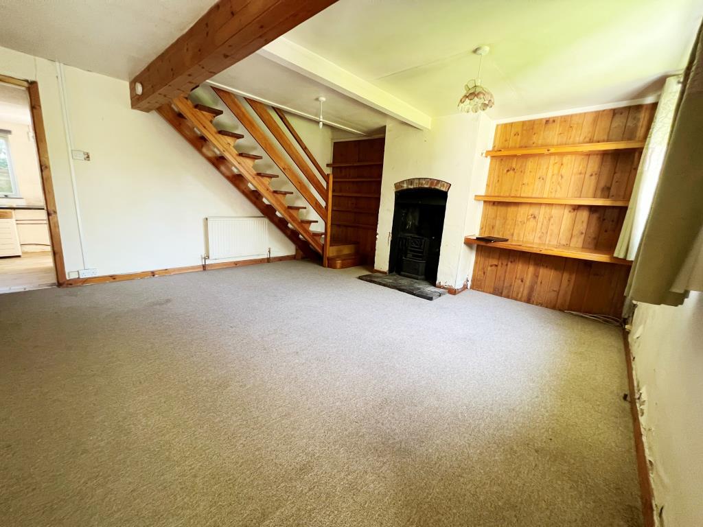 Lot: 62 - COTTAGE FOR IMPROVEMENT - Living room with stairs to first floor
